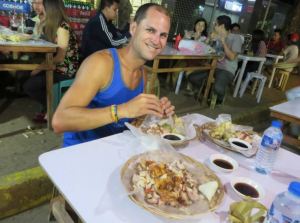 Dave eating Lechon in Cebu.